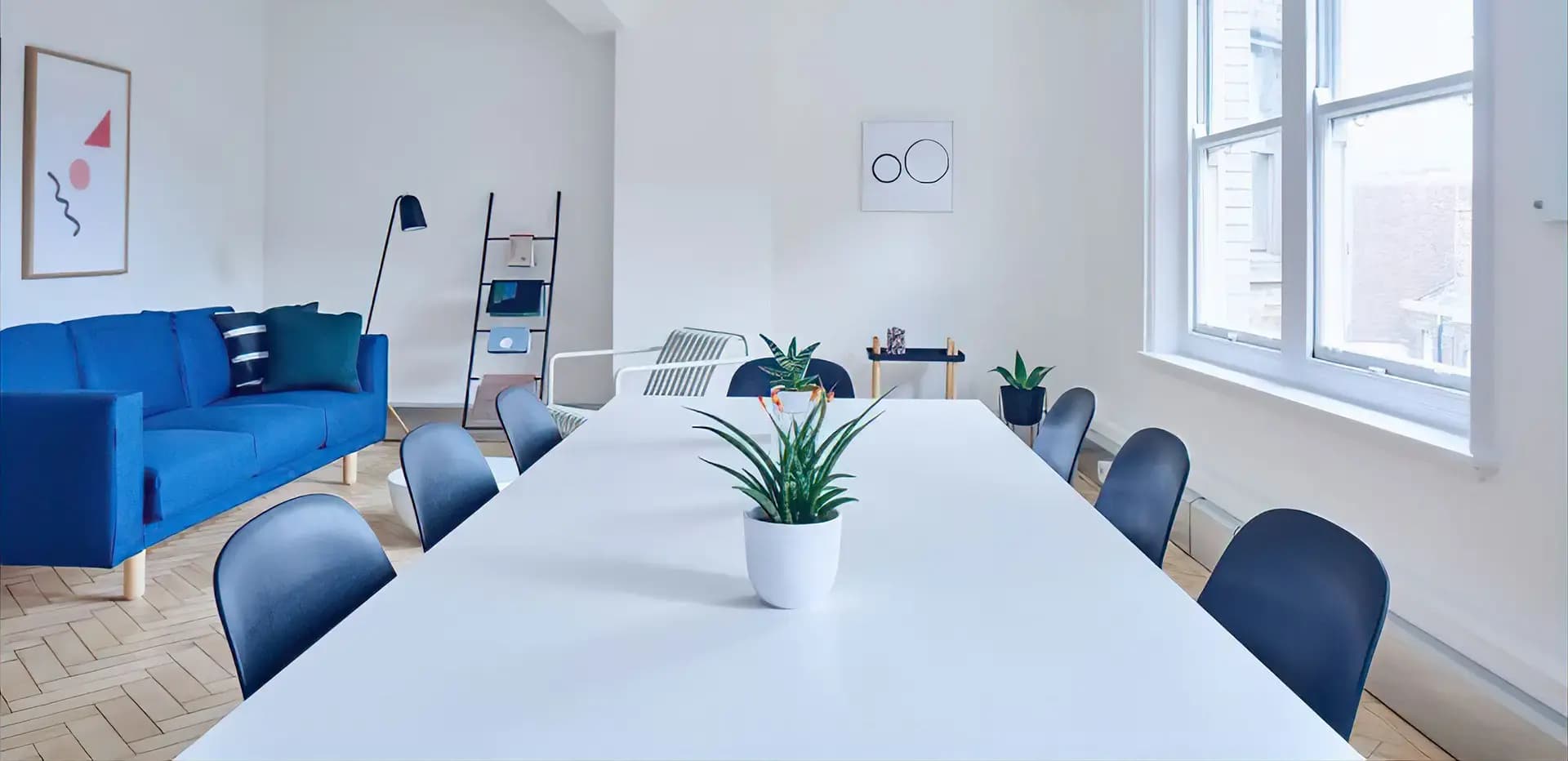 Room with a table and blue chairs